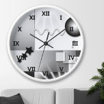 Reloj de pared de estilo Art Decó en blanco y negr<br><div class="desc">Reloj de pared con un diseño Art Deco lúdico en blanco y negro.</div>
