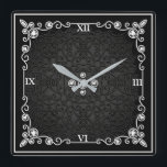 Reloj de pared de estilo Art Deco negro y plateado<br><div class="desc">Este reloj está hecho para parecer como si viniera de la época art deco - con muchas piedras metálicas y piedras preciosas para la riqueza. Este reloj hace grandes regalos a la gente comprando una nueva casa o redecorando la casa en la que están. Puede encontrar este reloj en Home...</div>