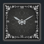 Reloj de pared de estilo Art Deco negro y plateado<br><div class="desc">Este reloj está hecho para parecer como si viniera de la época art deco - con muchas piedras metálicas y piedras preciosas para la riqueza. Este reloj hace grandes regalos a la gente comprando una nueva casa o redecorando la casa en la que están. Puede encontrar este reloj en Home...</div>