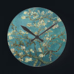 Reloj de pared de flores de almendra<br><div class="desc">Florecimiento de Almond por Vincent van Gogh La flor de almendras fue pintada en 1890 en honor a un evento especial en la vida de Vincent. El 31 de enero, el hermano de Vincent, Theo, y su esposa Johanna, tuvieron un hijo, y lo llamaron Vincent Willem. Vincent pintó esta rama...</div>