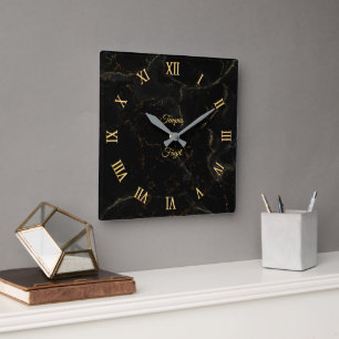 Reloj de pared de mármol negro con dorado (persona