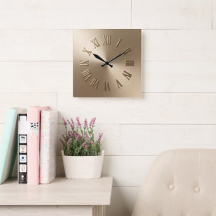 Reloj de pared de metal dorado falso elegante