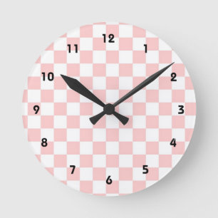 Reloj de pared de patrón de contraste rosa y blanc