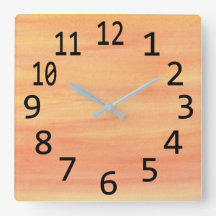 Reloj de pared de pinceladas amarillas y naranjas