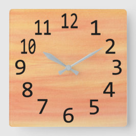 Reloj de pared de pinceladas amarillas y naranjas 