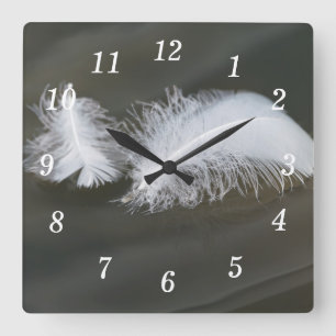 Reloj de pared de plumas de oca flotante