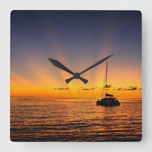 Reloj de pared de velero atardecer caribeño (Anverso)
