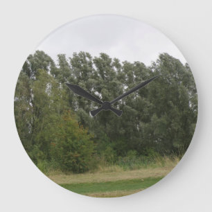 Reloj de pared del paisaje de la línea de árboles