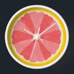 Reloj De Pared Grapefruit Slice Pop Art Cocina Minimalista<br><div class="desc">Este colorido reloj de pomelo es perfecto para su cocina o decoración de rincón del desayuno. Muestra una imagen abierta en rodajas de un cítrico de pomelo, mitad con 12 rodajas en tonos rosas alternados, para que puedas distinguir el tiempo sin números. Este diseño inusual tiene un aspecto texturizado -...</div>