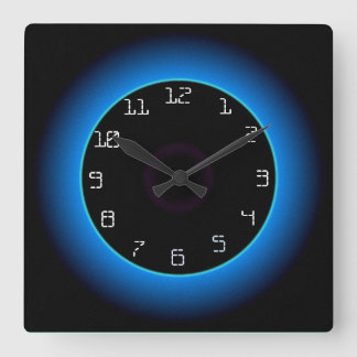 Reloj de pared iluminado azul/agua sobre negro
