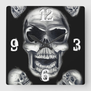 Reloj de pared negro de los cráneos humanos