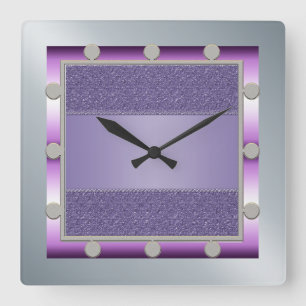 Reloj de pared púrpura y de plata