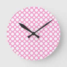 Reloj de pared rosa con lunares blancos