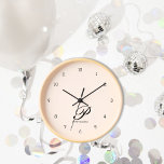 Reloj de pared rosado monogramado Rubor<br><div class="desc">Sumérjase en la sofisticación con nuestro Reloj de pared de guiones personalizado para cautivar a Rubor Pink. El delicado tipo de letra del guión, con su primer nombre inicial y completo, le da un toque de encanto personalizado a su espacio vital. Diseñado con materiales de alta calidad, este reloj de...</div>