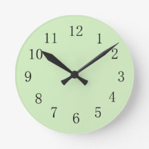 Reloj de pared verde del té pálido