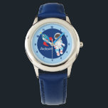 Reloj De Pulsera Astronauta espacial de Guay<br><div class="desc">Un barco con cohetes Guay y un astronauta en el espacio exterior vigilan a un niño pequeño. Personalizar este impresionante reloj azul con el nombre de tu hijo u otro texto debajo de la adorable nave espacial azul y roja al lado del hombre flotando en el espacio.</div>