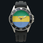 Reloj De Pulsera Bandera gabonesa (Gabón)<br><div class="desc">Este diseño presenta la bandera nacional de Gabón, que es un país en la costa oeste de África Central. Gabón está situado en el ecuador. El Gabón tiene frontera con Guinea Ecuatorial al noroeste; el Camerún al norte; la República del Congo al este y al sur; y el Golfo de...</div>