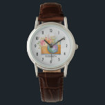 Reloj De Pulsera Cámara Boho Naranja y acuarela con buquet floral<br><div class="desc">Un reloj personalizado con un ilustracion acuarela de una cámara naranja y un ramo de flores sobre la parte superior. Las flores del ramo son rosa claro y naranja con hojas verdes, un arreglo floral bonito. Los números de la cara de reloj están en un tipo de letra art deco....</div>