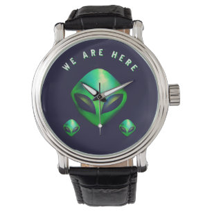 Reloj De Pulsera "Estamos Aquí" cabeza de alienígena verde