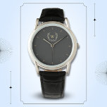 Reloj De Pulsera Monograma clásico de oro negro con correa de laure<br><div class="desc">Un diseño de laurel clásico en negro y oro,  que combina a la perfección encanto y elegancia. El monograma añade un toque especial. Ideal como regalo personalizado para la familia y los amigos</div>