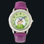 Reloj De Pulsera Un mono lindo buscando por detrás de un Bush<br><div class="desc">Un reloj con un ilustracion de un mono mirando por detrás de un arbusto verde saludando. Rodeado por una corona de hojas tropicales. Situado sobre un fondo de color verde oliva. Hola se puede personalizar con un nombre u otro texto si lo desea.</div>