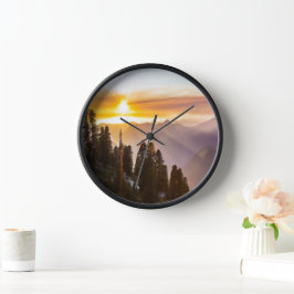 Reloj El atardecer sobre el bosque