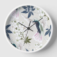 Los colibríes y las flores blancas.