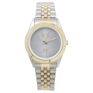Reloj metálico con cráneo de búfalo dorado