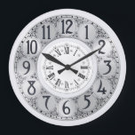 Reloj Redondo Grande Art Deco Elegante regalo elegante de unisex de pla<br><div class="desc">Un ilustracion vintage Art Deco con círculos falsos de plata bordeados por negros alrededor de los cuales aparecen garabatos de remolinos negros está enmarcado por un círculo blanco más pequeño en el que aparecen números romanos.</div>