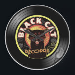 Reloj Redondo Grande Black Cat LP Art Deco<br><div class="desc">¿Eres el gato más genial de por aquí? ¡Creemos que sí! ..y creó la máxima declaración de humor y música. Elegante e inteligente, nuestra combinación de gato misterioso y marca de música suave hará que todos tus amigos se pregunten dónde lo tienes... agarren algo de frescura con este diseño de...</div>