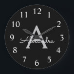 Reloj Redondo Grande Black Silver Modern Script Girly Monograma Nombre<br><div class="desc">Reloj de nombres de monograma de escritura simple en negro y plateado. Esto hace que el dulce perfecto cumpleaños 16,  boda,  ducha de novia,  aniversario,  ducha de bebé o fiesta de soltera sea regalo para alguien que ama el lujo glam y los estilos de moda.</div>