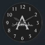 Reloj Redondo Grande Black Silver Modern Script Girly Monograma Nombre<br><div class="desc">Reloj de nombres de monograma de escritura simple en negro y plateado. Esto hace que el dulce perfecto cumpleaños 16,  boda,  ducha de novia,  aniversario,  ducha de bebé o fiesta de soltera sea regalo para alguien que ama el lujo glam y los estilos de moda.</div>