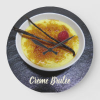 Creme brulee on slate with raspberry and vanilla