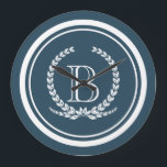 Reloj Redondo Grande Diseño del monograma<br><div class="desc">Diseño monograma con decoración de plumas laurel en forma redondeada a rayas sobre fondo azul</div>