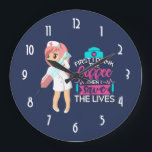 Reloj Redondo Grande Funny Nurse Saying Typography Hypodermic Needle<br><div class="desc">A clock with a humorous saying: First i drink the coffee,  then I save the lives. Perfect for nurses. Featuring an illustration of a female nurse wearing a cute old fashioned nursing hat and carrying a giant hypodermic needle. Dark blue background.</div>