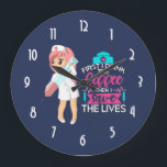 Reloj Redondo Grande Funny Nurse Saying Typography Hypodermic Needle<br><div class="desc">A clock with a humorous saying: First i drink the coffee,  then I save the lives. Perfect for nurses. Featuring an illustration of a female nurse wearing a cute old fashioned nursing hat and carrying a giant hypodermic needle. Dark blue background.</div>
