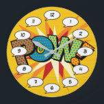 Reloj Redondo Grande Libro de historietas Pop Art POW<br><div class="desc">Relajados relojes pop de historietas de superhéroes de moda que seguro añaden un toque de color a una amplia gama de habitaciones alrededor de su casa u oficina. Una manera ideal de tratarte a ti mismo o a alguien que conozcas con estos geniales y únicos relojes de diseño de historietas....</div>