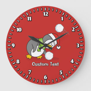 Reloj Redondo Grande Pingüino navidad recibiendo bola de nieve