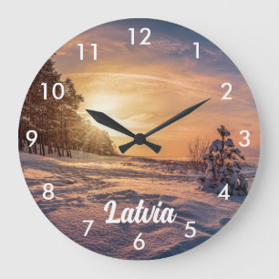 Reloj Redondo Grande Puesta de sol sobre la costa invernal nevada