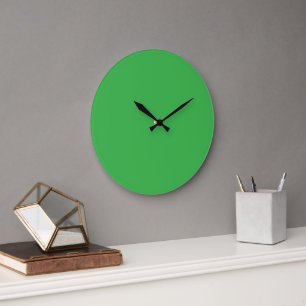 Reloj Redondo Grande Una pantalla verde brillante frente a una barra bl