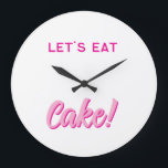 Reloj Redondo Grande Wall Clock<br><div class="desc">Add a sprinkle of sweetness to your space with this fun and playful wall clock! Featuring bold, pink typography and the delicious phrase “LET’S EAT Cake!”, this design is perfect for kitchens, dining rooms, cafés, or anywhere you want to serve up some joy. Whether you're a dessert lover, a baking...</div>