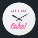 Reloj Redondo Grande Wall Clock<br><div class="desc">Add a sprinkle of sweetness to your space with this fun and playful wall clock! Featuring bold, pink typography and the delicious phrase “LET’S EAT Cake!”, this design is perfect for kitchens, dining rooms, cafés, or anywhere you want to serve up some joy. Whether you're a dessert lover, a baking...</div>