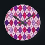 Reloj Redondo Mediano Art Deco Argyle<br><div class="desc">This wall clock has an art deco design of diamond shapes made from overlapping angles in black lines colored in shades of purple and pink with diagonal black lines making the design look like argyle</div>