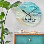 Reloj Redondo Mediano Beach Happy Place Watercolor Ocean Waves Costa<br><div class="desc">Crea un ambiente de vacaciones junto al mar con este fresco reloj de pared costero con acuarela de color turquesa tropical y olas oceánicas de fondo marino, pez estrella de coral y la leyenda "la playa es mi lugar feliz" en un tipo de letra de escritura náutica azul marino. Arte...</div>