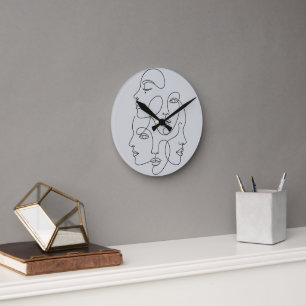 Reloj Redondo Mediano Caras minimalistas de una línea abstracta