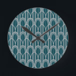 Reloj Redondo Mediano Dominios Art Deco<br><div class="desc">Este reloj tiene un diseño hecho de cúpulas y líneas verticales en plata en un campo de azul.</div>