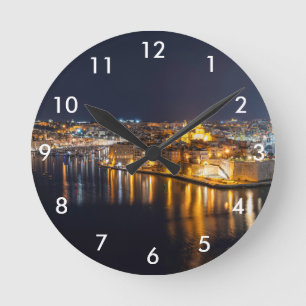 Reloj Redondo Mediano Harbor in Malta illuminated at night