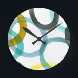 Reloj Redondo Mediano Interlocking Yellow & Blue Circles<br><div class="desc">A simple print of interlocking yellow and blue circles by Megan Meagher. The white background lets the colors of the circles pop. Purchase yours today!</div>
