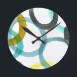 Reloj Redondo Mediano Interlocking Yellow & Blue Circles<br><div class="desc">A simple print of interlocking yellow and blue circles by Megan Meagher. The white background lets the colors of the circles pop. Purchase yours today!</div>