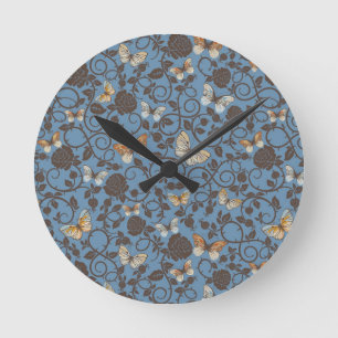Reloj Redondo Mediano modelo con los rosas y la mariposa